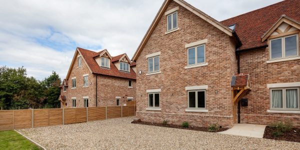 Cottenham, Cambridgeshire - Sept 7 2018: Modern three storey brick build home on recently completed housing development with gravel driveway
